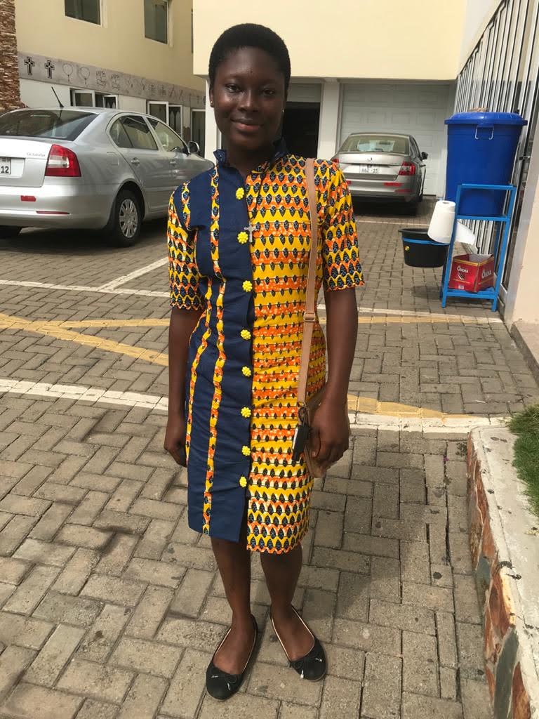 A woman in African print sewn by Perpetual&Philomina